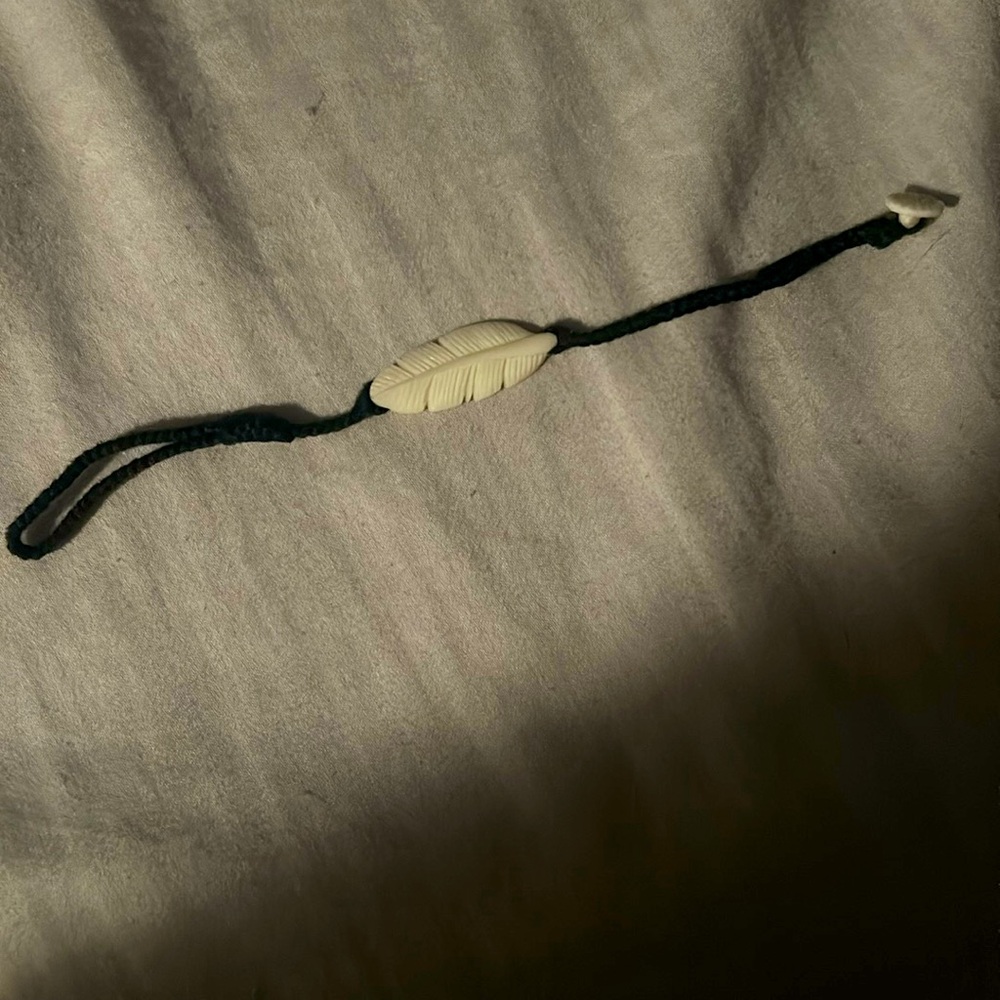 NWOT wanderer bracelet ivory feather with button closure